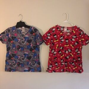 TWO women’s Disney nursing/vet med/dental scrub tops Disney size small